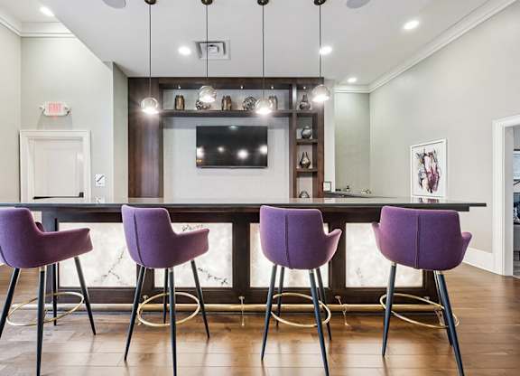 Community Clubhouse Kitchenette Area with TV at Dulles Green Apartments located in Herndon, VA.