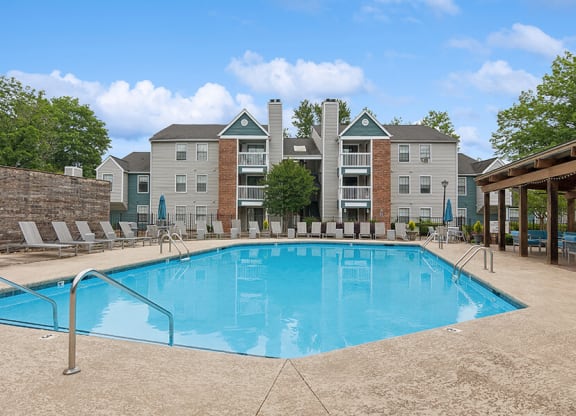 Community Swimming Pool with Pool Furniture at Park 2300 Apartments in Charlotte, NC.