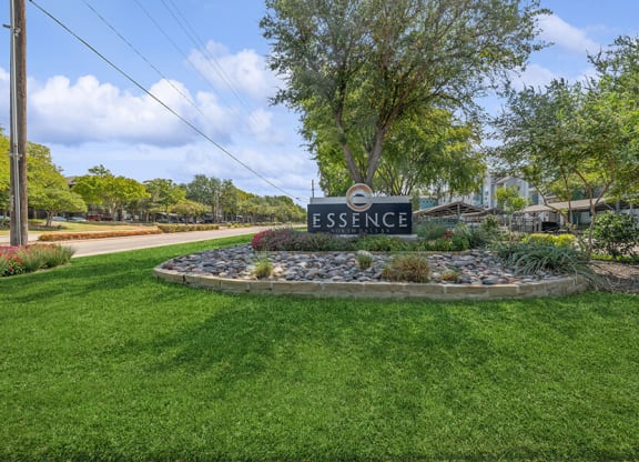 Monument Sign and Front Entrance at Essence Apartments in Dallas, TX.