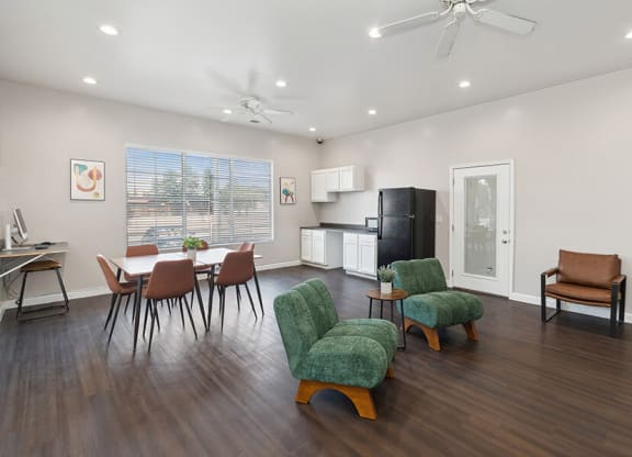 Community Clubhouse with Lounge Furniture and Kitchenette Area at Indigo Park Apartments located in Albuquerque, NM.
