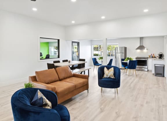 Resident clubhouse with a couch chairs and a table at Lakeside Casitas in Tucson, AZ