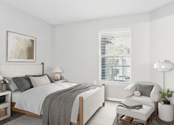 Model Bedroom with Carpet and Window View at Retreat at Crosstown Apartments in Riverview, FL.