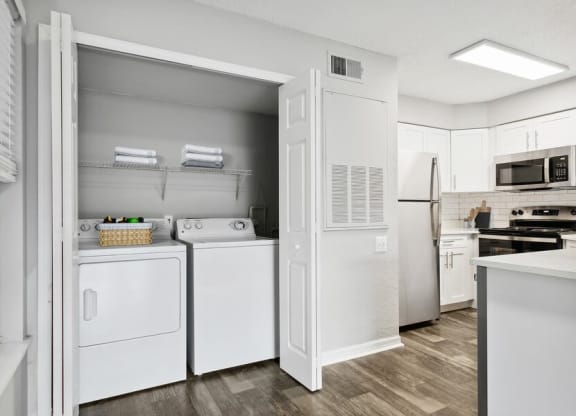 Model laundry closet near kitchen