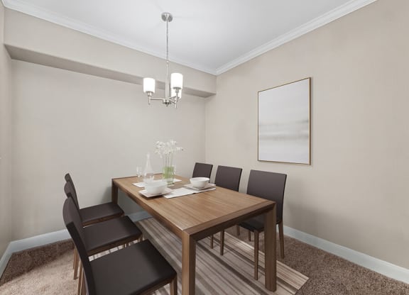 Model Dining Room with Carpet at Park West Apartments located in Houston, TX.