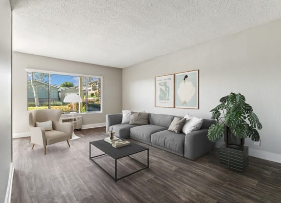 Model Living Room with Wood-Style Flooring & Window View at Forest Park Apartments in El Cajon, CA.