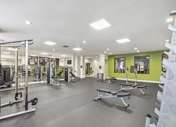Community Fitness Center with Equipment at Madison Park Apartments located in Anaheim, CA.