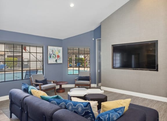 Community Clubhouse with Lounge Furniture and TV at Creek 2645 Apartments in Sacramento, CA.