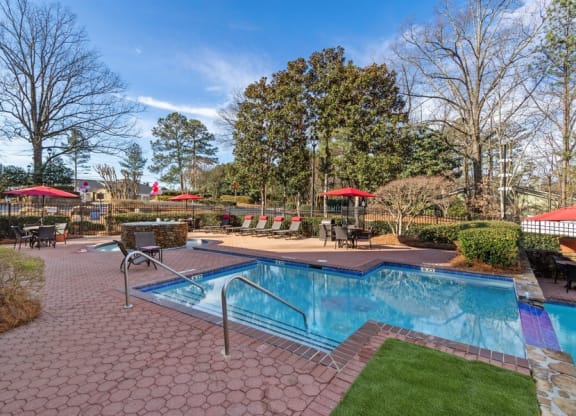 Community pool and custom paver sundeck