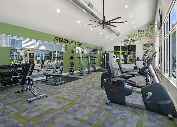 Community Fitness Center with Equipment at Broadmoor Village Apartments located in West Jordan, UT.