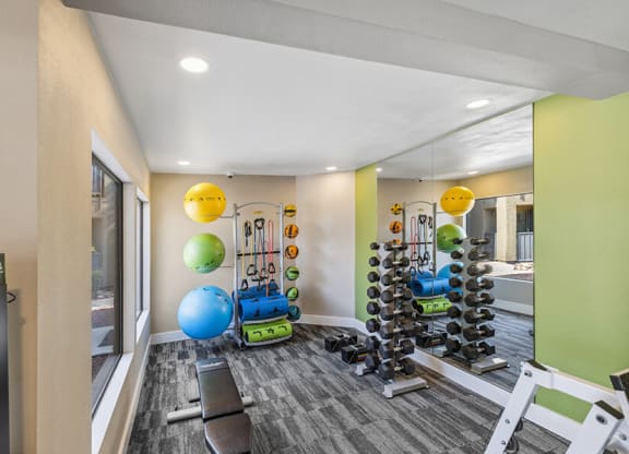 Community Fitness Center with Equipment at Saddle Ridge Apartments in Tucson, AZ.