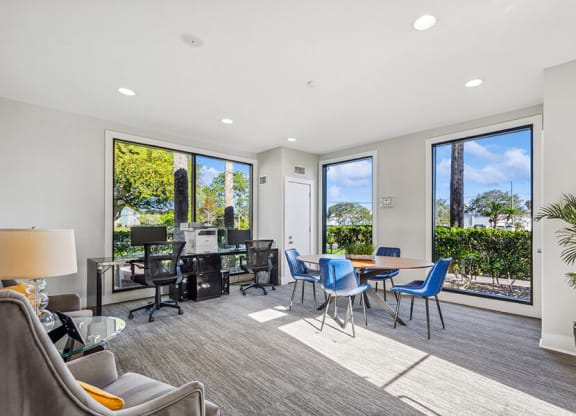 Community Leasing Office with Workstation Area at Bridges at Bayside Apartments in St. Petersburg, FL.