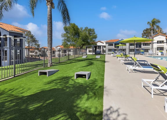 Outdoor Corn Hole Area at Hilands Apartments in Tucson, AZ.