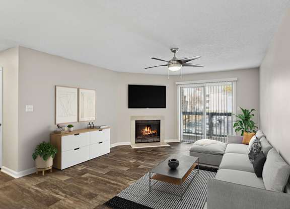 Model Living Room with Wood-Style Flooring, Fireplace and Patio Accessibility at Element 41 Apartments located in Marietta, GA.