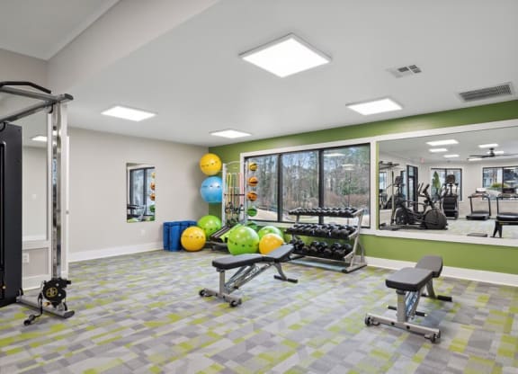 Community Fitness Center with Equipment and Mirrors at Element 41 Apartments in Marietta, GA.