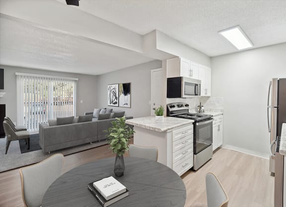 Model Dining Room and Kitchen Area with View of Living Room at Waterfront Apartments in Lakewood, CO.