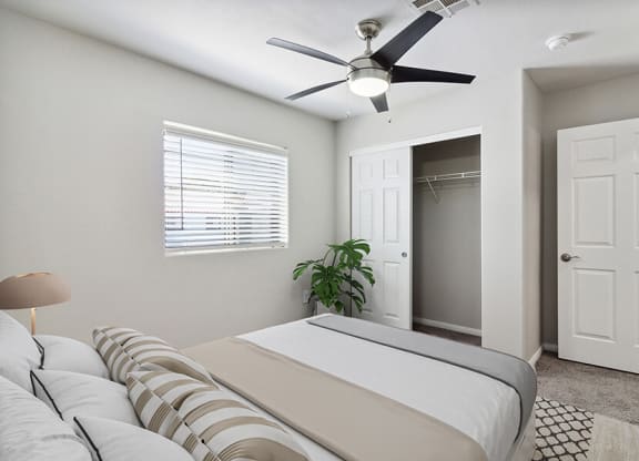 Model Bedroom with Carpet, Closet & Window View at Loma Vista Apartments in Las Vegas, NV.