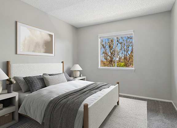 Model Bedroom with Carpet and Window View at Fullerton Hills Apartments located in Fullerton, CA.
