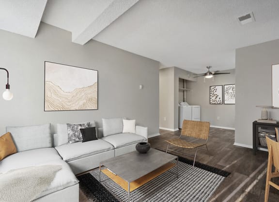 Model Living Room with Wood-Style Flooring at Liberty Creek Apartments in Aurora, CO.