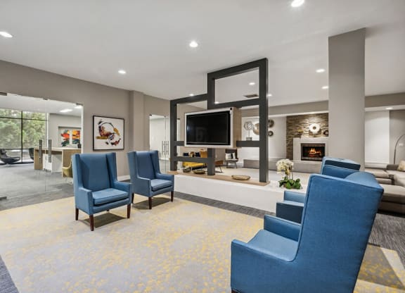 Community Clubhouse with Lounge Furniture, TV & Fireplace at Mason Van Dorn Apartments located in Alexandria, VA.