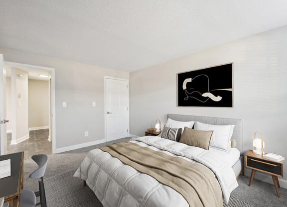 Model Bedroom with Carpet and Hallway View at Middlesex Crossing Apartments in Billerica, MA.