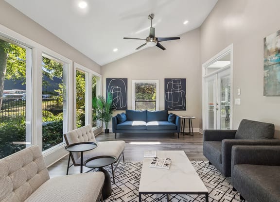 Community Clubhouse with Lounge Furniture at Lakeside Retreat Apartments located in Peachtree Corners, GA.