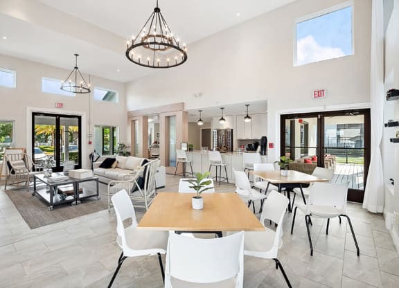 Community Clubhouse with Lounge Furniture at Rosehill Preserve Apartments in Orlando, FL.