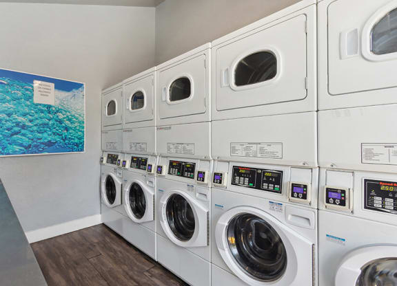 Community Laundry Center with stacked Washing Machines & Dryers at The Archer Apartments in Sacramento, CA.