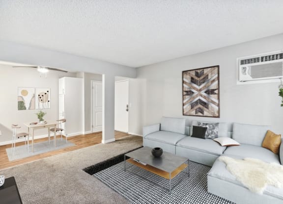 Model living room with view of dining