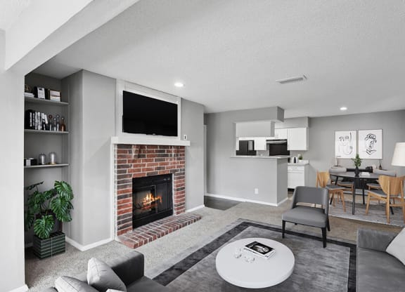 Model Living Room with Carpet and View of Kitchen/Dining Area at Abbington Heights Apartments in Antioch, TN.