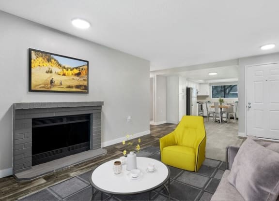 Model living room with vinyl flooring and fireplace
