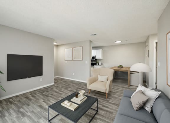 Model apartment living room with view of dining area