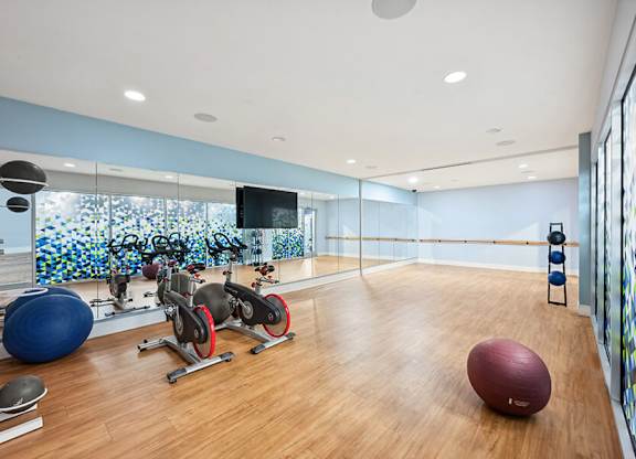 Community Fitness Center with Equipment at Dulles Green Apartments located in Herndon, VA.