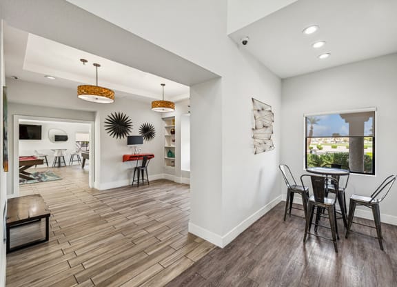Community Clubhouse with Game Tables and Lounge Furniture at Stonegate Apartments located in Las Vegas, NV.