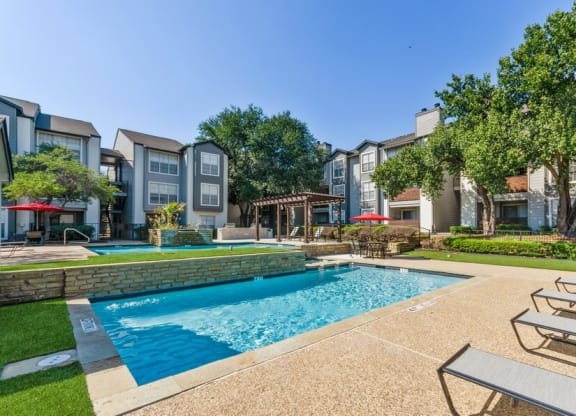 Poolside cabanas and lounge chairs at Cobblestone, Arlington, TX