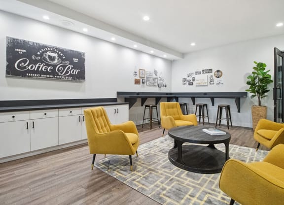 Community Clubhouse with Lounge Furniture at Madison Park Apartments located in Anaheim, CA.