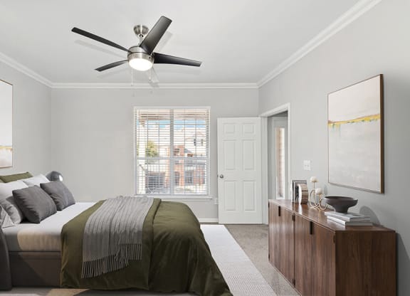 Model Bedroom with Carpet and Window View at Chapel Hill Apartments in Lewisville, TX.