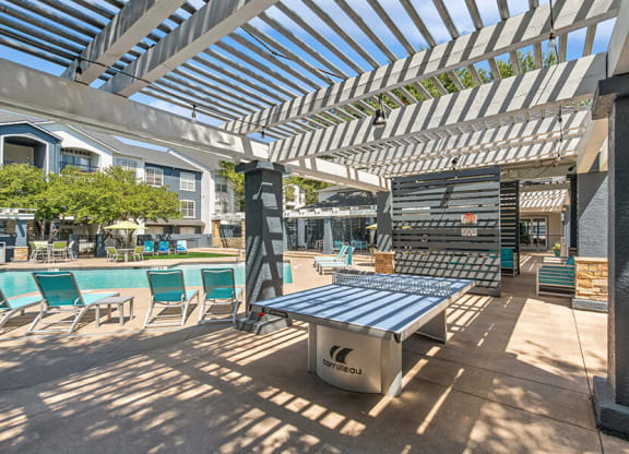 Outdoor Ping Pong Table and Pool Area at Allure North Dallas Apartments in Dallas, TX.