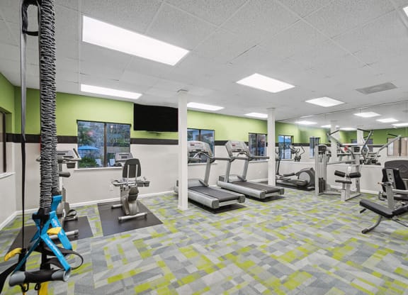 Community Fitness Center with Equipment at Westland Park Apartments in Jacksonville, FL.