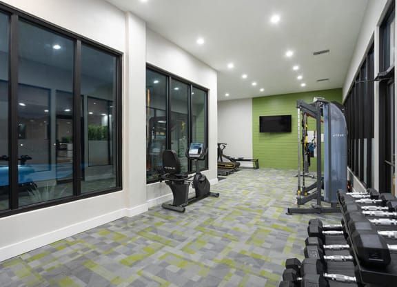 Community Fitness Center with Equipment at Haven at Water's Edge Apartments in Tampa, FL.