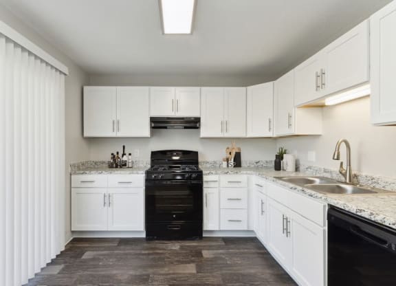 Model kitchen with updated white cabinets