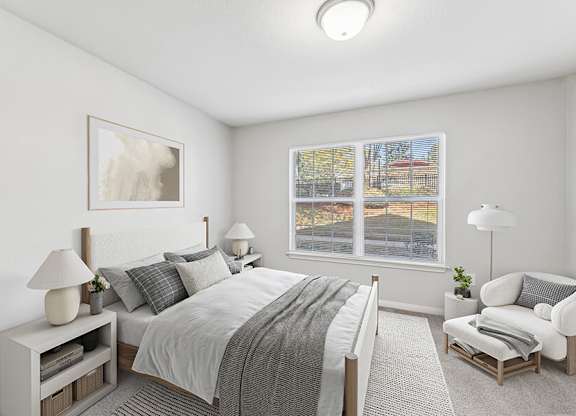 Model Bedroom with Carpet and Window View at Lake Cameron Apartments located in Apex, NC.
