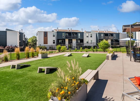 Outdoor Corn Hole Area at Waterfront Apartments in Lakewood, CO.