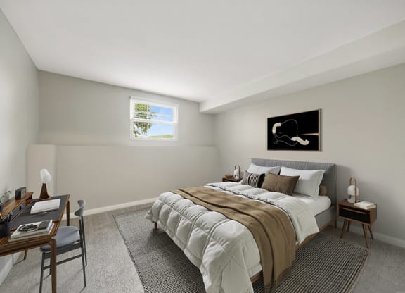 Model Bedroom with Carpet and Window View at Meadows at Marlborough Apartments located in Marlborough, MA.