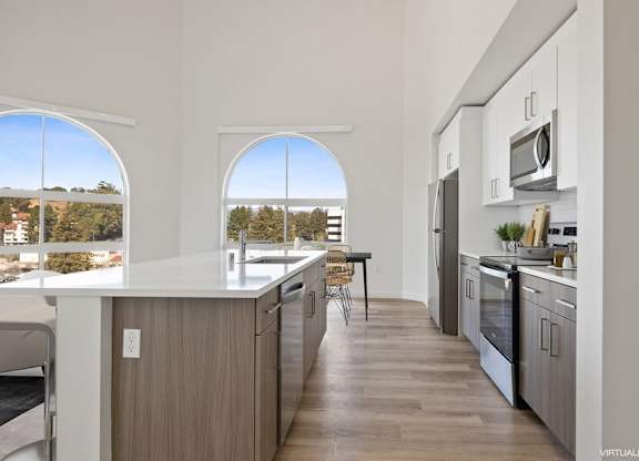 Model kitchen with large arch window