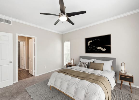 Model Bedroom with Carpet and Window View at Allure North Dallas Apartments located in Dallas, TX.