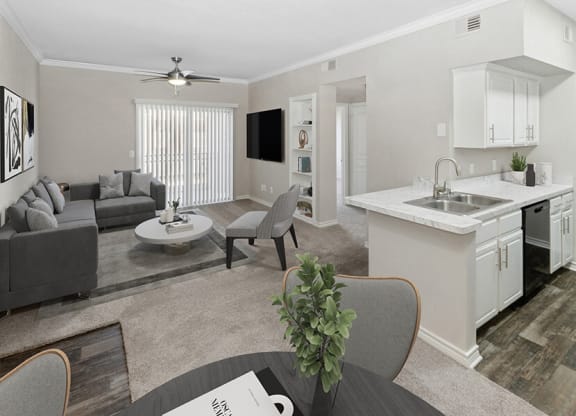 Model Dining Room and Kitchen Area with View of Living Room at Belmont at Duck Creek Apartments in Garland, TX.
