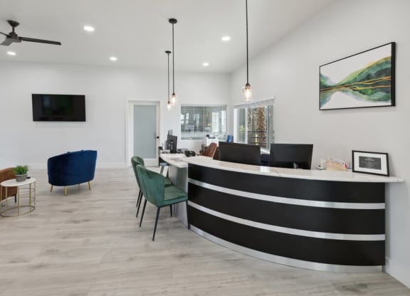 A lobby with a reception desk and chairs  at Lakeside Casitas in Tucson, AZ