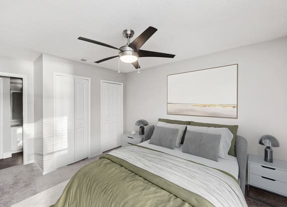 Model Bedroom with Carpet and attached Bathroom at Vue at Baymeadows Apartments in Jacksonville, FL.