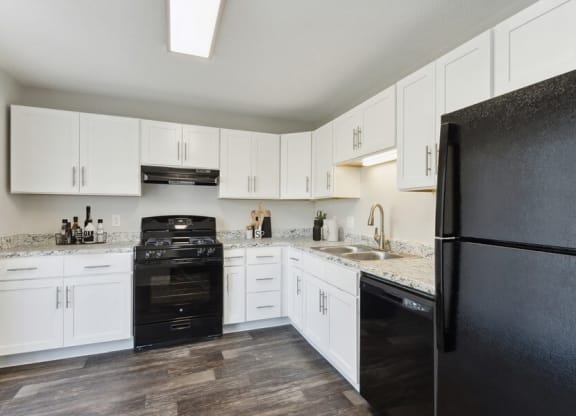 Model kitchen with all-black kitchen appliances