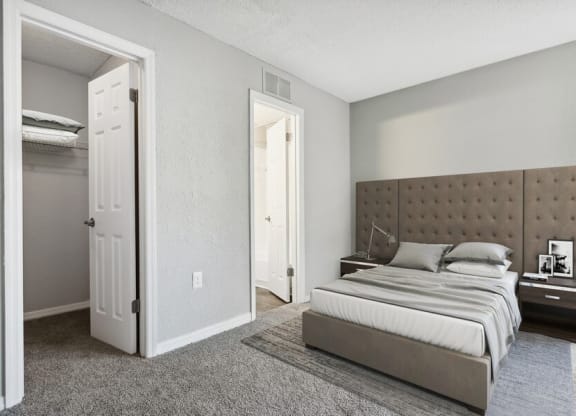 Model bedroom with walk-in closet